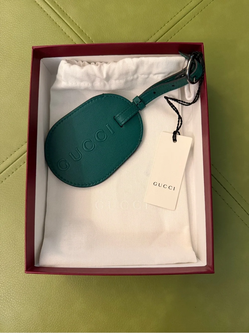 NWT Gucci Oval Leather Luggage Tag with Embossed Logo